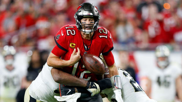 Tampa Bay Buccaneers quarterback Tom Brady (12) fumbles the ball in the second half against the New Orleans Saints at Raymond James Stadium.